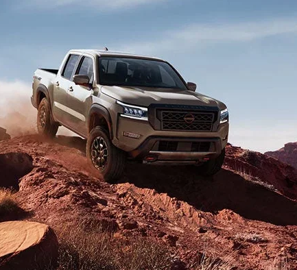 a 2024 Nissan Frontier off-roading.