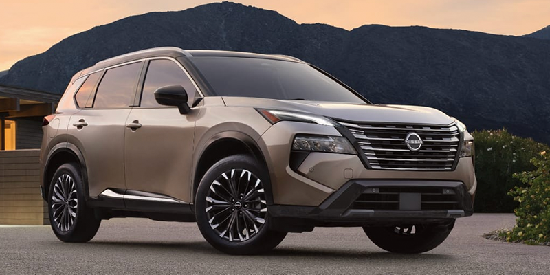 2026 Nissan Rogue parked outdoors with mountain backdrop