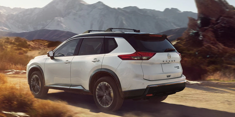 New 2026 Nissan Rogue cruising through off-road patch