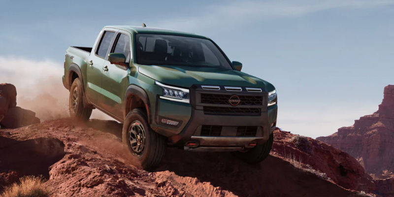 2026 Green Nissan Frontier down Climbing the mountain